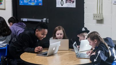 iLEAD Lancaster Charter School learners with laptops