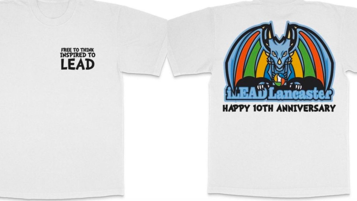 Front and back photo of 10th anniversary t-shirts with the new dragon logo.