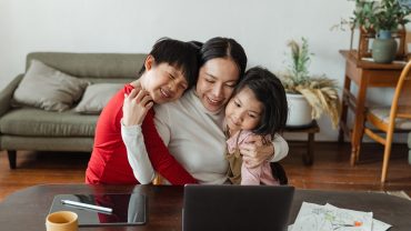 mom hugs son and daughter