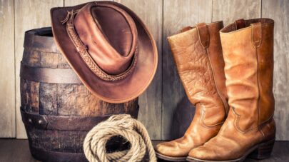 cowboy boots, hat, rope, barrel
