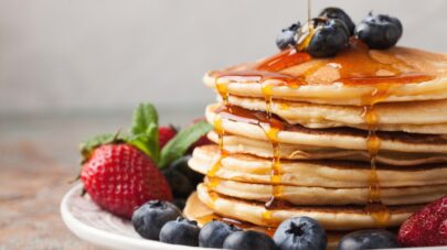 pancakes syrup strawberries blueberries