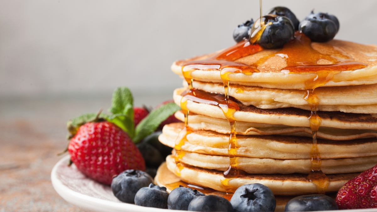 pancakes syrup strawberries blueberries